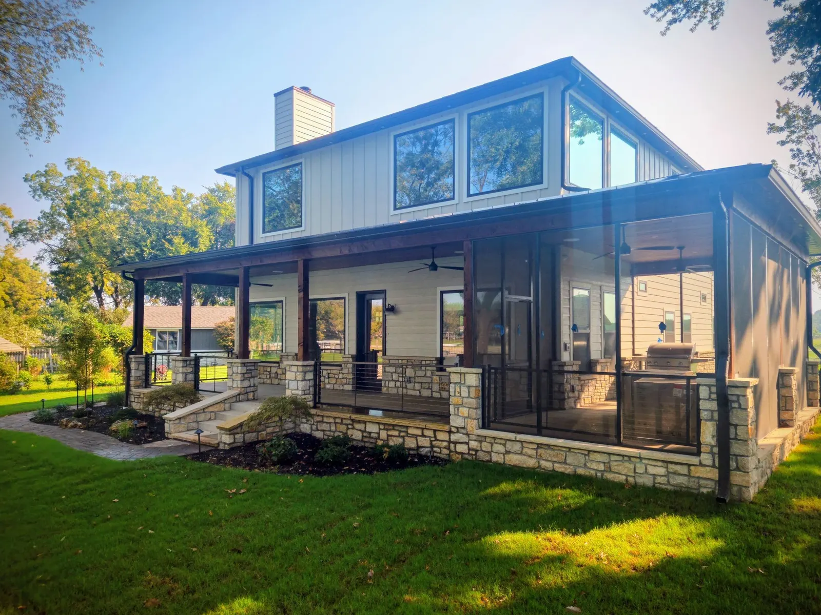 Custom black handrails on a covered porch