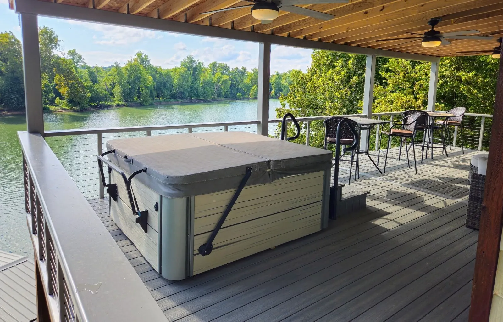 Lakeside deck with black metal railing