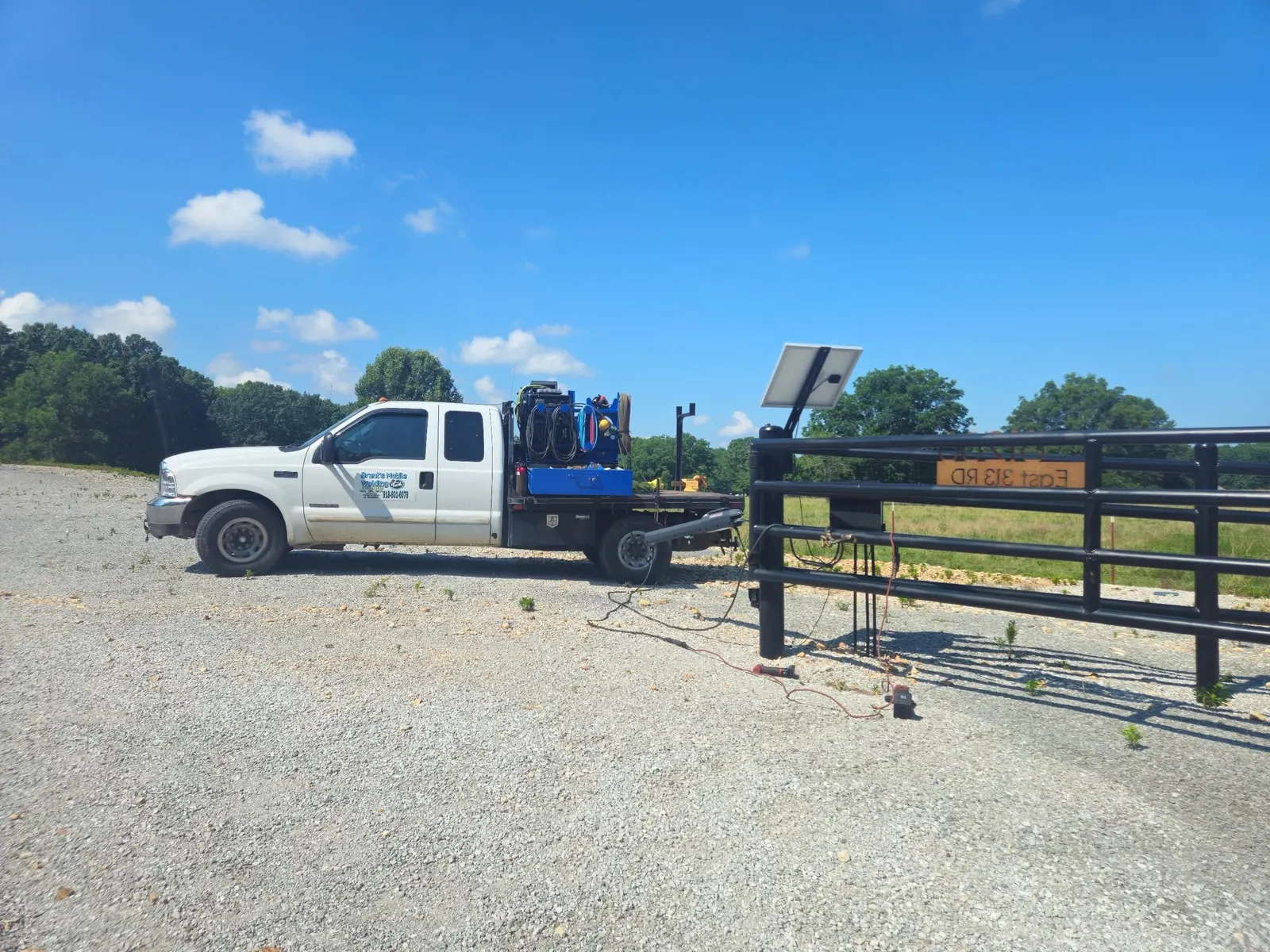 Brent's mobile welding truck at a real fence jobsite